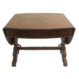 A GERMAN BURR WALNUT SOFA TABLE the oval top with beaded edge above a single drawer and turned