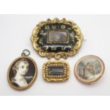 THREE MOURNING BROOCHES AND A PENDANT two of the brooches are mounted in un-hallmarked yellow metal,
