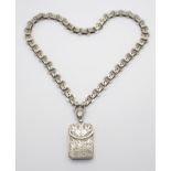 A VICTORIAN WHITE METAL LOCKET AND CHAIN with star detailed chain and the locket in the shape of a