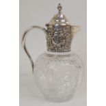 A SILVER MOUNTED CLARET JUG by Plante & Company, Birmingham 1887, the top with foliate embossing and