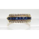 AN 18CT GOLD SAPPHIRE AND DIAMOND LINEAR CLUSTER RING set with 0.22cts of brilliant cut diamonds and