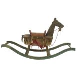 A 19TH CENTURY NAIVE CONTINENTAL PAINTED ROCKING HORSE on bow rocker, 108cm high x 193cm wide