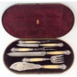 A CASED VICTORIAN SILVER CARVING AND FISH SERVING SET by Harrison Brothers & Howson, Sheffield 1880,
