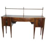 A GEORGE III STYLE MAHOGANY AND INLAID SERPENTINE SIDEBOARD with brass curtain rail above two