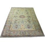A KASHAN PALE GREEN RUG with central medallion surrounded by floral designs and border, 270cm x