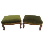 A PAIR OF VICTORIAN FOOT STOOLS with green covers on carved scroll legs, 18cm high x 35cm wide x