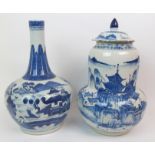 A CHINESE BLUE AND WHITE BALUSTER VASE painted with figures crossing a bridge beside an island