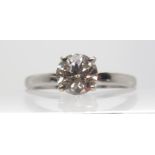 A 9CT WHITE GOLD DIAMOND SOLITAIRE WITH A HINT OF PINK estimated approx at just over 1ct, in four