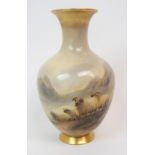 A ROYAL WORCESTER VASE of baluster shape, painted with sheep in a rocky mountain landscape, signed H
