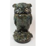 A DUNMORE POTTERY OWL TOBACCO JAR modelled on naturalistic base in browny green and blue glazes 23.