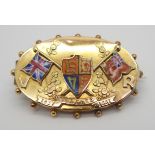 A YELLOW METAL AND ENAMEL BROOCH CELEBRATING VICTORIA'S GOLDEN JUBILEE with flags and shield