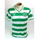A GREEN AND WHITE CELTIC SHORT-SLEEVED SHIRT with v-neck collar and embroidered cloth badge, the