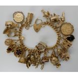 A large and extensive 9ct gold charm bracelet, to include an 1899 gold full sovereign, a 1907 gold