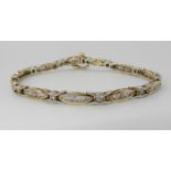 A 9ct gold diamond set line bracelet, set with estimated approx 2cts of brilliant cut diamonds