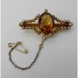 A bright yellow metal brooch set with pearls and a citrine, weight approx 6.4gms Condition Report: