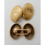 A pair of floral engraved 15ct gold cufflinks, weight approx 6.8gms Condition Report: Available upon
