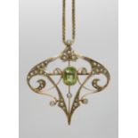 A 9ct gold peridot and pearl Edwardian pendant 3.8cm x 3.8cm with a 9ct gold box chain length