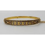 A 15ct gold and diamond set Etruscan revival designed bangle, weight approx 10gms Condition