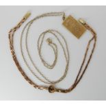 A 9ct gold ingot pendant 2cm x 1.3cm, length of 9ct chain 54cm and a 9ct gold sapphire set bracelet,