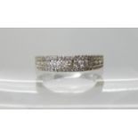 An 18ct gold diamond set wedding band to match the previous lot 53, set with estimated approx 0.