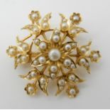 An 18ct gold Edwardian pendant brooch set with pearls, weight 7.9gms Condition Report: Available