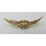 A bright yellow metal crescent moon and flower brooch set with pearls, weight approx 3.9gms