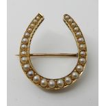 A bright yellow metal pearl set horseshoe brooch weight approx 5.2gms Condition Report: Available