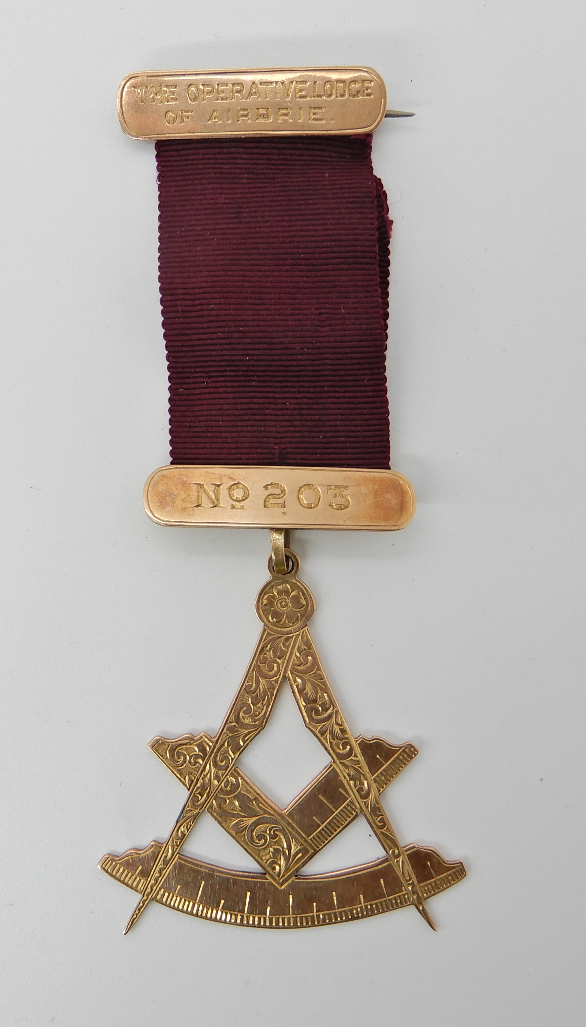 A 9ct gold Masonic medallion, length 12.7cm, weight including ribbon 21.9gms Condition Report: