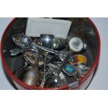 A collection of white-metal souvenir teaspoons and souvenir cigarette case and lighter Condition