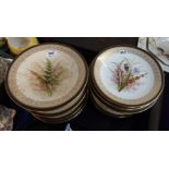 A Royal Worcester dessert set painted with flowers and ferns including a tall tazza, two low