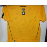 A yellow Scotland replica football shirt, the front bearing numerous player autographs Condition