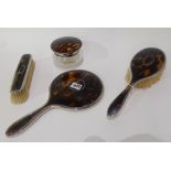 A four piece silver and tortoiseshell mounted dressing table brush set by W & H Birmingham 1925
