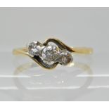 An 18ct and platinum three stone diamond ring of estimated approx 0.25cts, size N, weight 2.4gms