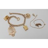 A 9ct gold curb link bracelet, hung with four charms to include; a 9ct magic carpet, and yellow