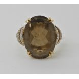 A 9ct gold smoky quartz and diamond ring by QVC, quartz approx 18mm x 13mm, size V1/2, weight 5.8gms