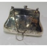 A silver purse by Henry Matthews, Birmingham 1914, of handbag shape with foliate engraving,