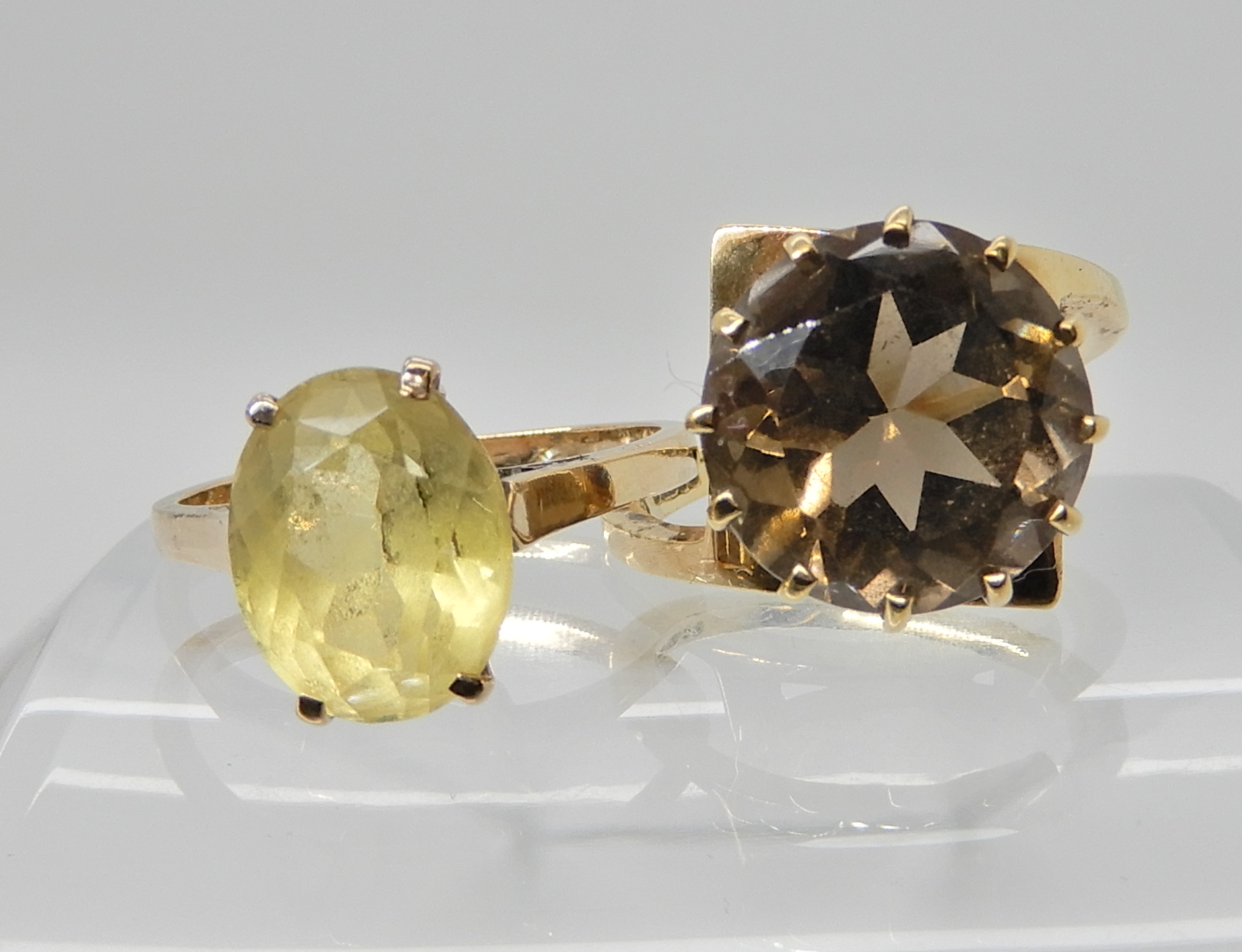 A 9ct gold retro smoky quartz ring size L1/2 and a 9ct gold citrine ring size N, weight 6.9gms