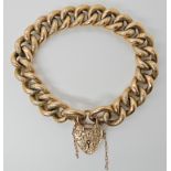 A 9ct gold curb link bracelet with heart shaped clasp, length 20.5cm, weight 30.2gms Condition