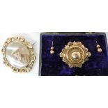 A 9ct gold Victorian locket back brooch dimensions 4.4cm x 3.5cm and earrings in original box and