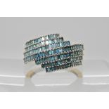 A 9ct gold blue baguette diamond dress ring, combined estimated approx diamond weight 1.5cts. finger