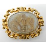 A yellow metal locket back brooch with a glazed Mourning Hair Art panel dimensions 4.2cm x 3.3cm,