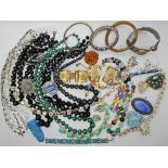 A bag full of vintage costume jewellery to include a Jean Painleve seahorse cuff bangle, with