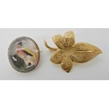 An 18ct gold ivy leaf brooch, length 3.8cm, weight 6.6gms and a bright yellow metal feather work
