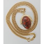 A 9ct gold curb chain, length 62cm, with a double sided moss agate and jasper set swivel fob, length