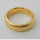 A bright yellow metal wedding ring, size K1/2, weight 9.2gms Condition Report: Available upon