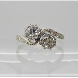 An 18ct white gold and platinum twin stone diamond ring of estimated approx 0.40cts, finger size