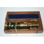 A lacquered brass cased microscope Condition Report: Available upon request