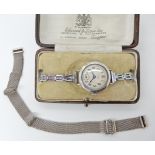 A silver vintage watch with chromed strap and the original woven silver strap Condition Report: