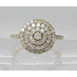 A 9ct gold diamond cluster ring, head size 13mm diameter, set with estimate approx combined