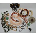 A bag full of vintage costume jewellery to include a large plaid brooch etc Condition Report: